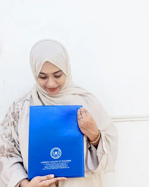 London College of Teachers graduate holding her certificate folder